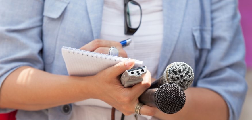 reporter holding mic